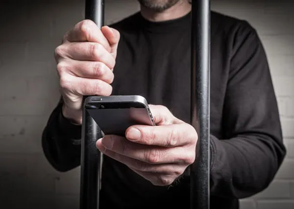 How does the prison block mobile phone signals